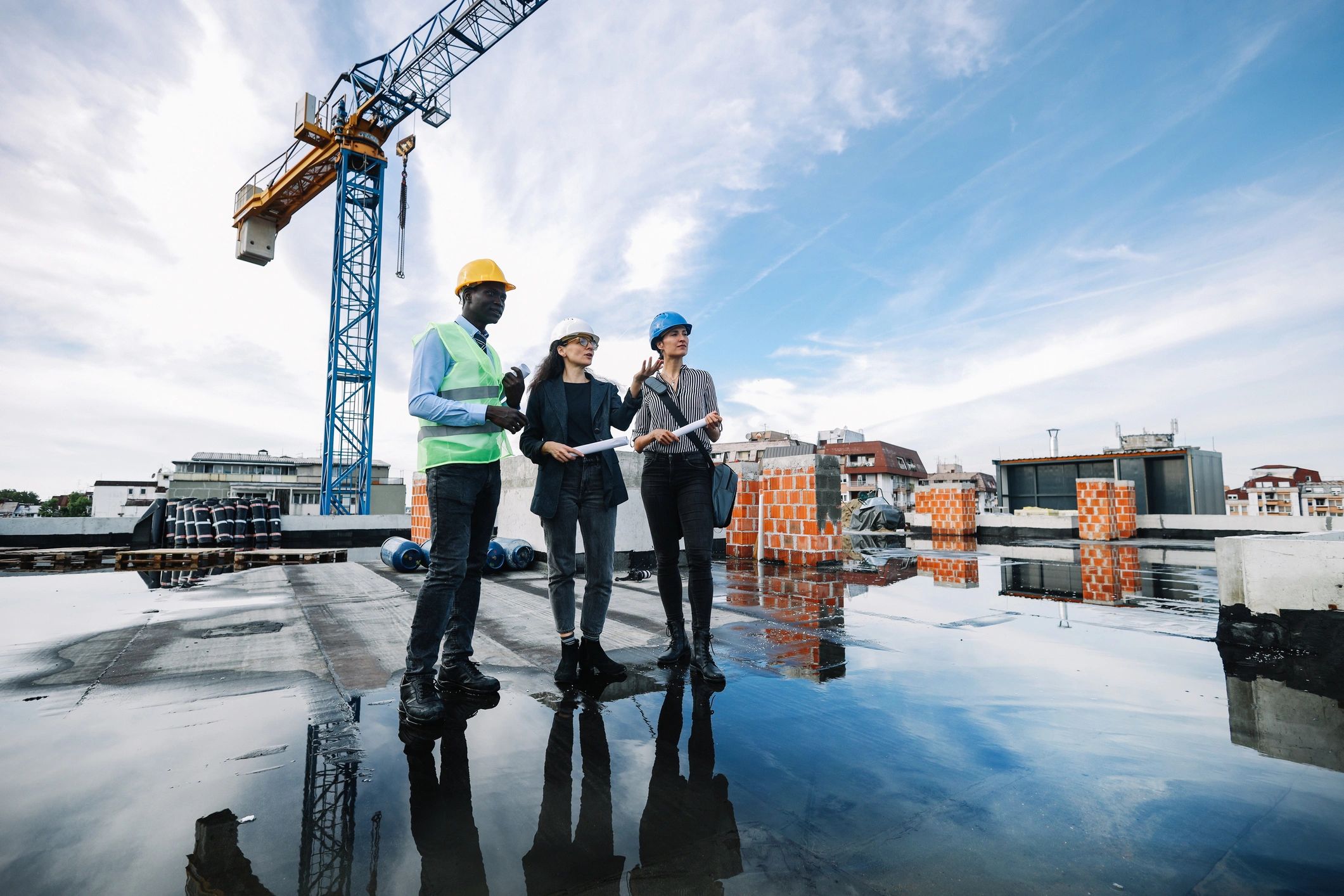 Construction team meeting on an active jobsite