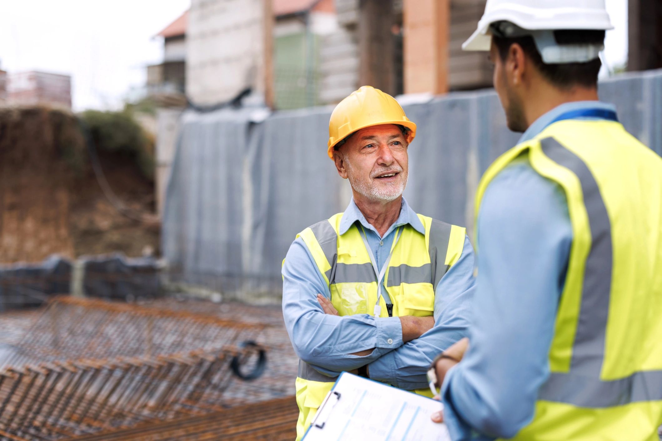 Construction professionals discussing progress on site