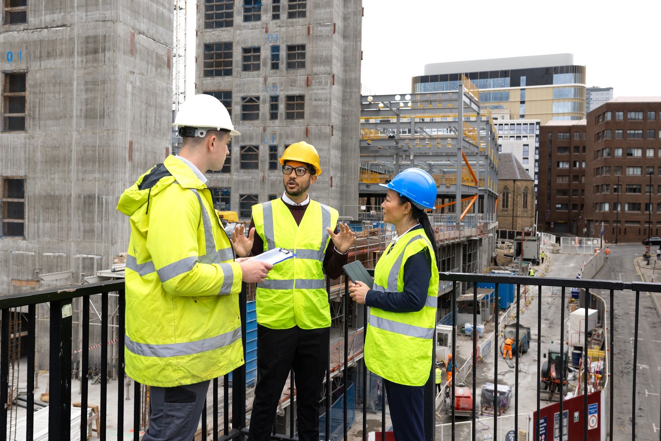 Construction team discussing plans together at a jobsite