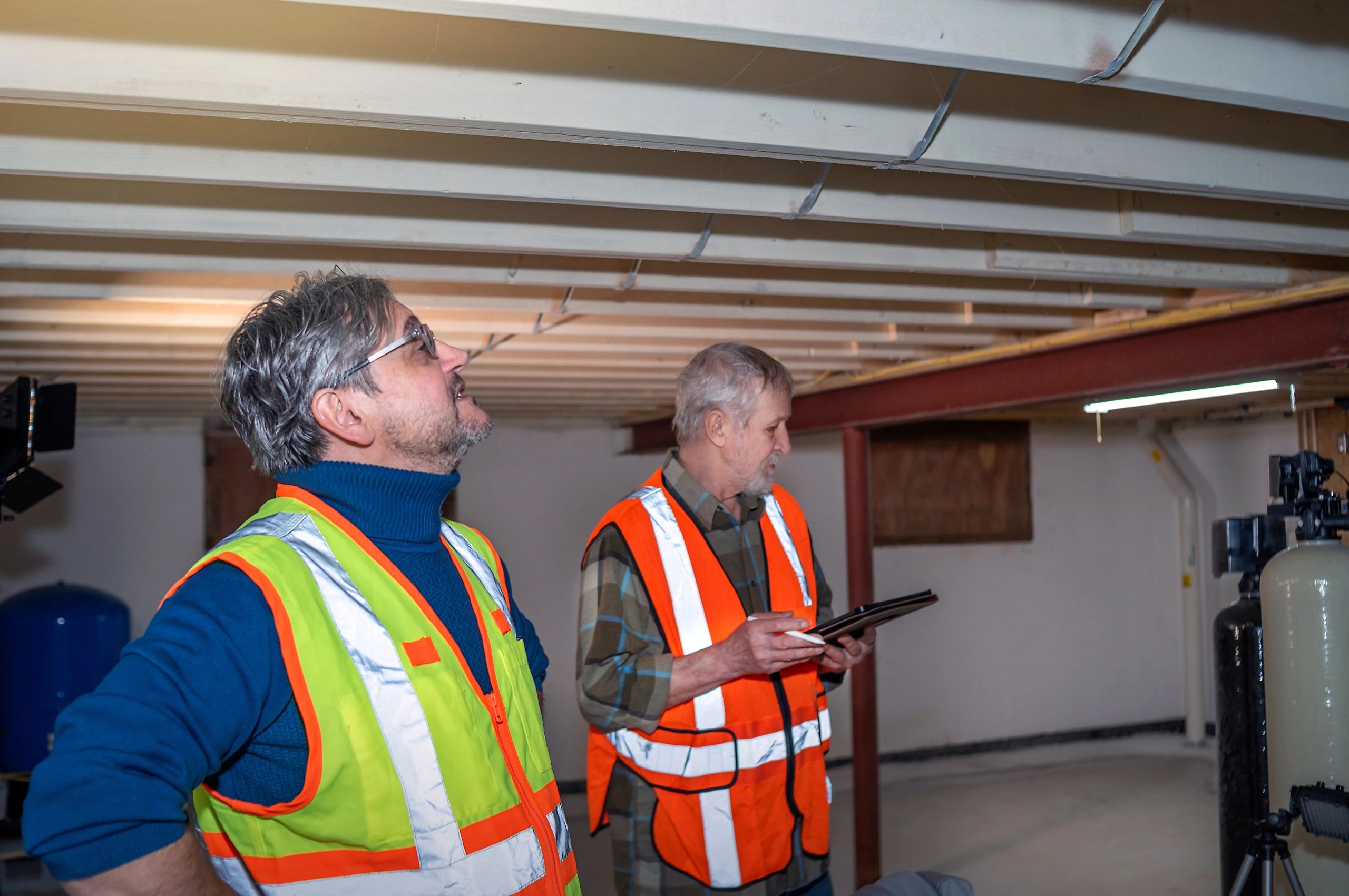 Professionals inspecting structural elements in a residential project